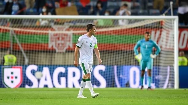 Faro , Portugal - 1 September 2021; Seamus Coleman of Republic of Ireland reacts after conceding their second goal, scored by Cristiano Ronaldo of...