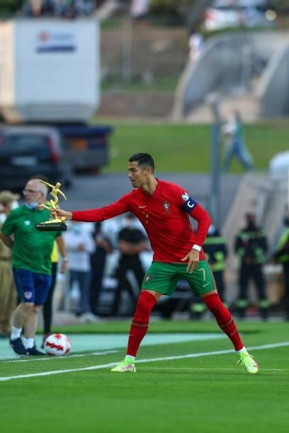 Cristiano Ronaldo of Manchester United and Portugal with the trophy of Best Goal Score of Euro 2020 during the 2022 FIFA World Cup Qualifier match...