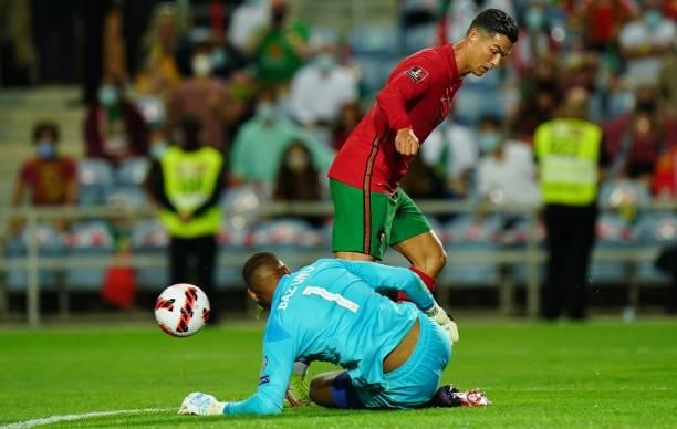 Cristiano Ronaldo of Manchester United and Portugal with Gavin Bazunu of Republic of Ireland and Portsmouth in action during the World Cup 2022...