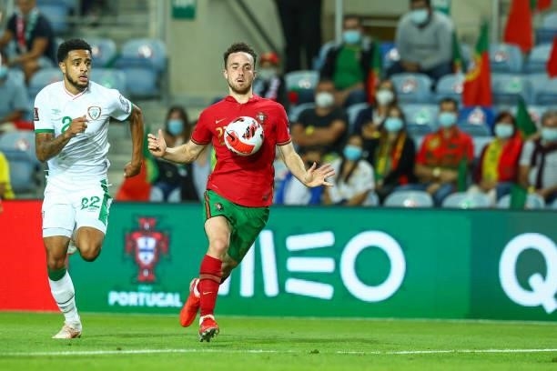 Diogo Jota of Liverpool FC and Portugal tries to escape Andrew Omobamidele of Republic of Ireland and Norwich City during the 2022 FIFA World Cup...
