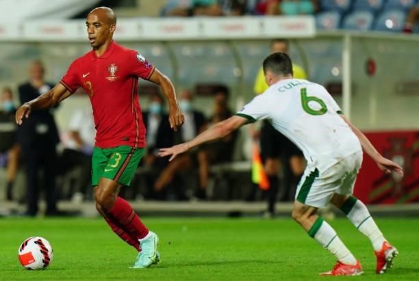 Joao Mario of SL Benfica of Portugal with Josh Cullen of Republic of Ireland and Anderlecht in action during the World Cup 2022 Qualifier match...