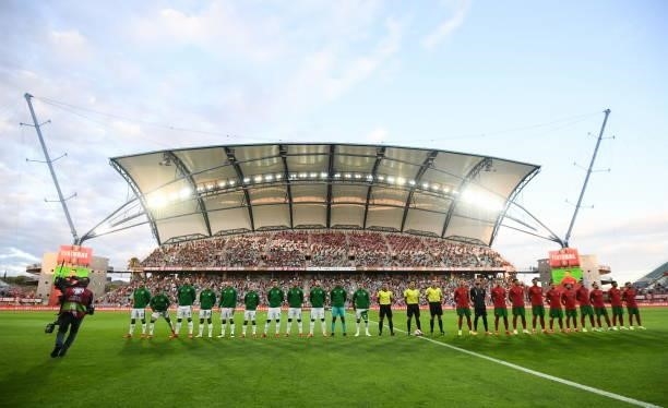 Faro , Portugal - 1 September 2021; Players of both sides and officials line-up before the FIFA World Cup 2022 qualifying group A match between...