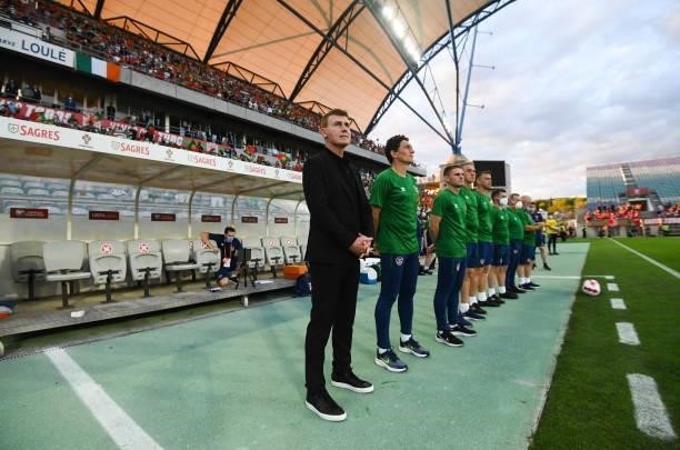 Faro , Portugal - 1 September 2021; Republic of Ireland manager Stephen Kenny, left, stands with his backroom staff for the national anthem before...