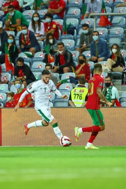 Matt Doherty of Republic of Ireland and Tottenham Hotspur tries to pass trough Joao Cancelo of Manchester City and Portugal during the 2022 FIFA...