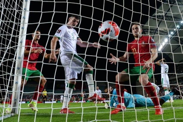 Faro , Portugal - 1 September 2021; John Egan of Republic of Ireland kicks the ball in frustration after his side conceded their first goal, scored...