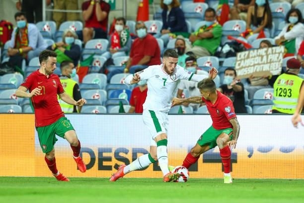 Matt Doherty of Republic of Ireland and Tottenham Hotspur tries to pass trough Joao Cancelo of Manchester City and Portugal during the 2022 FIFA...