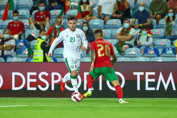 Aaron Connolly of Republic of Ireland and Brighton tries to escape Joao Cancelo of Manchester City and Portugal during the 2022 FIFA World Cup...