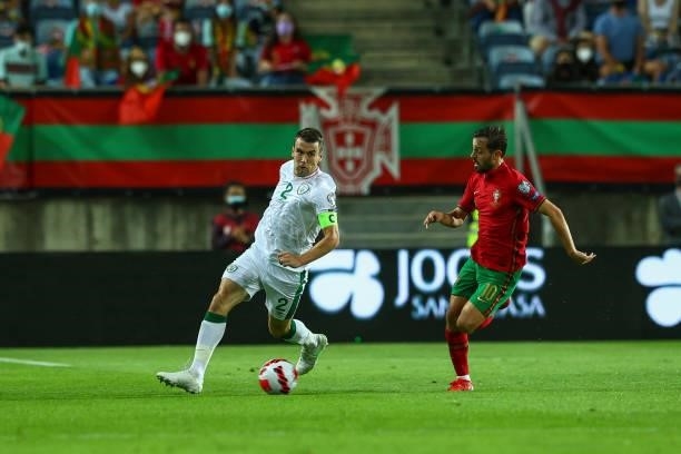 Seamus Coleman of Republic of Ireland and Everton tries to escape Bernardo Silva of Manchester City and Portugal during the 2022 FIFA World Cup...