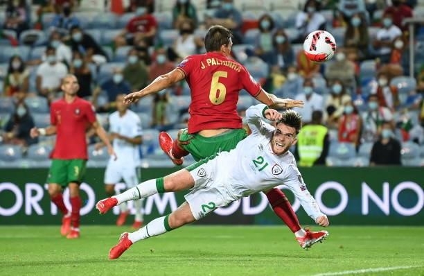 Faro , Portugal - 1 September 2021; Aaron Connolly of Republic of Ireland and João Palhinha of Portugal during the FIFA World Cup 2022 qualifying...
