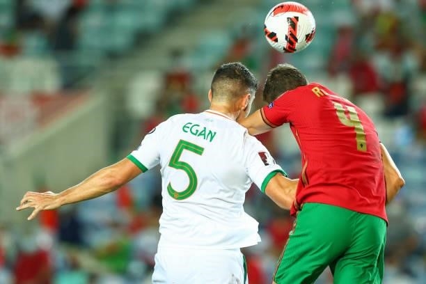 John Egan of Republic of Ireland and Sheffield United vies with Ruben Dias of Manchester City and Portugal for the ball possession during the 2022...
