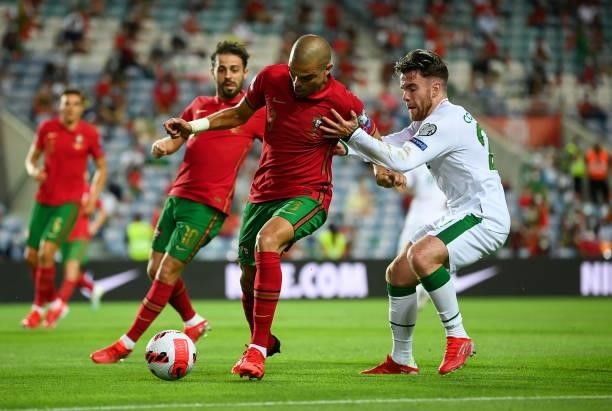 Faro , Portugal - 1 September 2021; Pepe of Portugal and Aaron Connolly of Republic of Ireland during the FIFA World Cup 2022 qualifying group A...