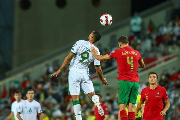 Adam Idah of Republic of Ireland and Norwich City vies with Ruben Dias of Manchester City and Portugal during the 2022 FIFA World Cup Qualifier match...