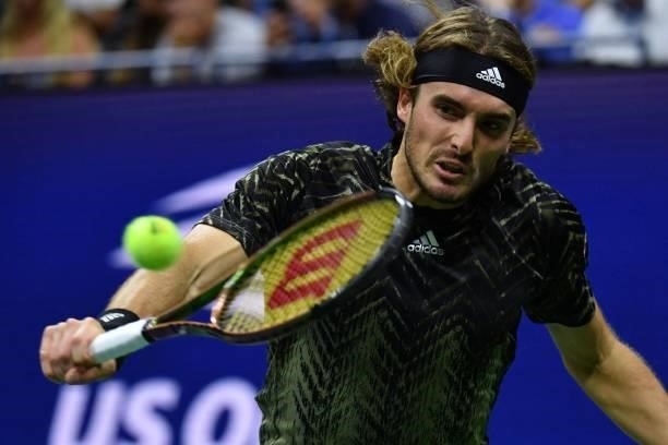 Greece's Stefanos Tsitsipas hits a return to France's Adrian Mannarino during their 2021 US Open Tennis tournament men's singles second round match...