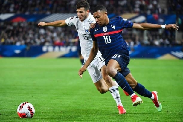 Kylian MBAPPE of France and Branimir CIPETIC of Bosnia and Herzegovina during the FIFA World Cup 2022 Qatar qualifying match between France and...
