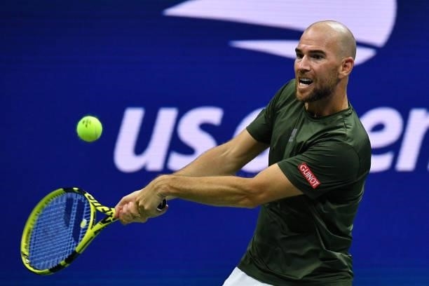 France's Adrian Mannarino hits a return to Greece's Stefanos Tsitsipas during their 2021 US Open Tennis tournament men's singles second round match...
