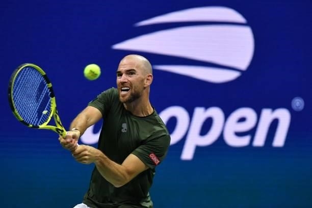 France's Adrian Mannarino hits a return to Greece's Stefanos Tsitsipas during their 2021 US Open Tennis tournament men's singles second round match...