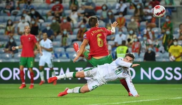 Faro , Portugal - 1 September 2021; Aaron Connolly of Republic of Ireland is tackled by João Palhinha of Portugal during the FIFA World Cup 2022...