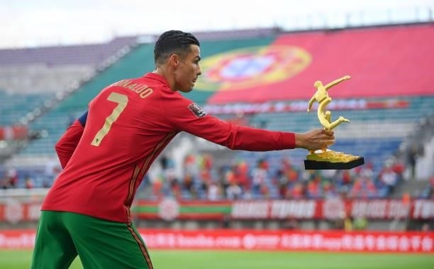 Faro , Portugal - 1 September 2021; Cristiano Ronaldo of Portugal with the UEFA EURO 2020 Alipay Top Scorer Award before the FIFA World Cup 2022...