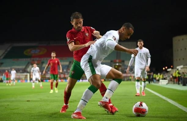 Faro , Portugal - 1 September 2021; Adam Idah of Republic of Ireland in action against Bernardo Silva of Portugal during the FIFA World Cup 2022...