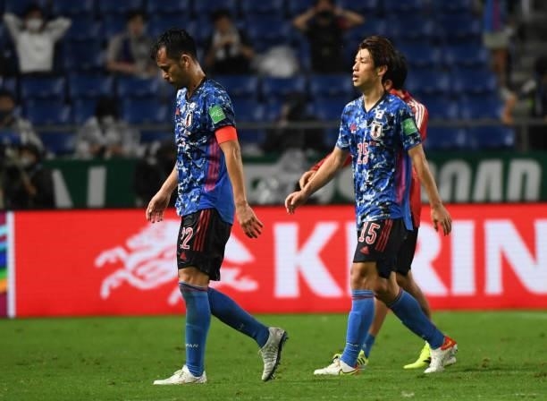 Maya Yoshida and Yuya Osako of Japan regret the loss during FIFA World Cup Asian Qualifier Final Round Group B match between Japan and Oman at...