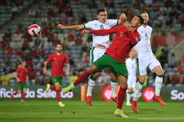 Faro , Portugal - 1 September 2021; Cristiano Ronaldo of Portugal in action against Josh Cullen of Republic of Ireland during the FIFA World Cup 2022...