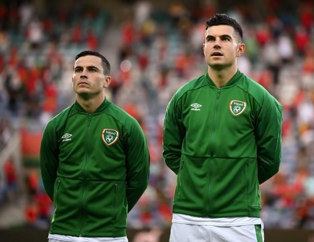 Faro , Portugal - 1 September 2021; Josh Cullen, left, and John Egan of Republic of Ireland stand for the playing of the National Anthem before the...