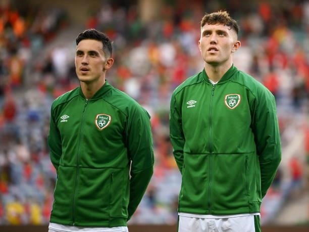 Faro , Portugal - 1 September 2021; Jamie McGrath, left, and Dara O'Shea of Republic of Ireland stand for the playing of the National Anthem before...