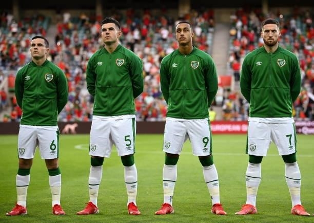 Faro , Portugal - 1 September 2021; Republic of Ireland players, from left, Josh Cullen, John Egan, Adam Idah and Matt Doherty stand for the playing...