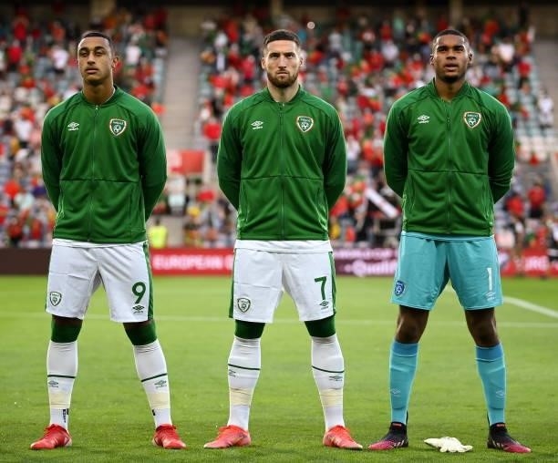 Faro , Portugal - 1 September 2021; Republic of Ireland players, from left, Adam Idah, Matt Doherty and Gavin Bazunu stand for the playing of the...