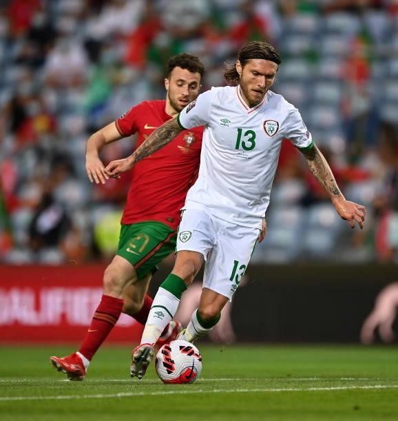 Faro , Portugal - 1 September 2021; Jeff Hendrick of Republic of Ireland in action against Diogo Jota of Portugal during the FIFA World Cup 2022...
