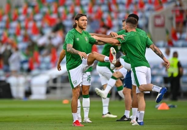 Faro , Portugal - 1 September 2021; Jeff Hendrick of Republic of Ireland, left, warms-up beofre the FIFA World Cup 2022 qualifying group A match...