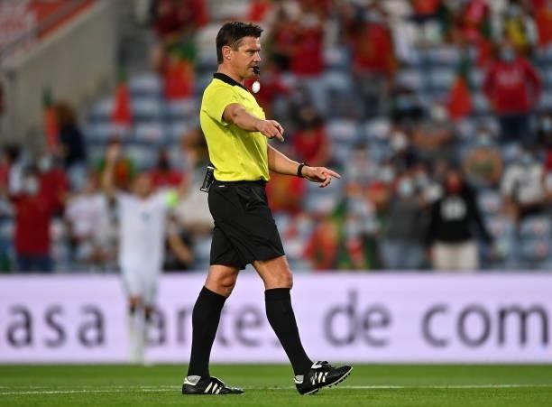 Faro , Portugal - 1 September 2021; Referee Matej Jug awards a penalty to Portugal during the FIFA World Cup 2022 qualifying group A match between...
