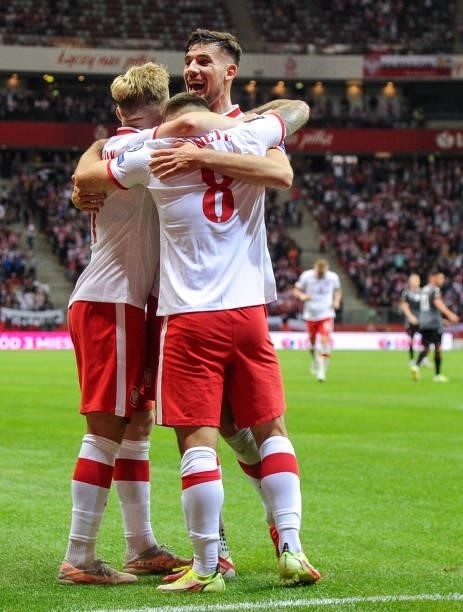Karol Linetty, Kamil Jozwiak and Jakub Moder celebrates scoring the goal with during the 2022 FIFA World Cup Qualifier match between Poland and...