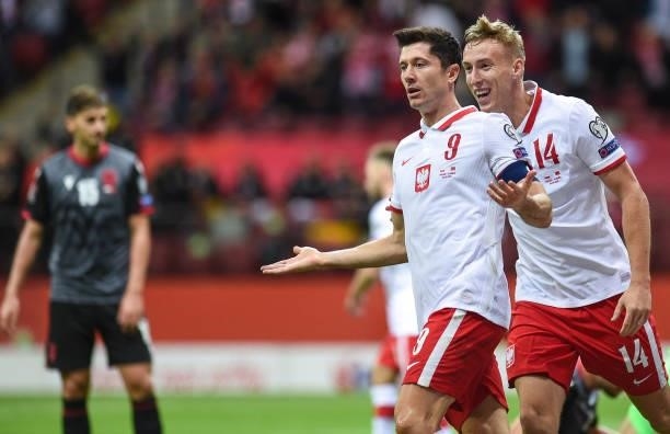 Adam Buksa and Robert Lewandowski of Poland reacts during the 2022 FIFA World Cup Qualifier match between Poland and Albania at National Stadium on...