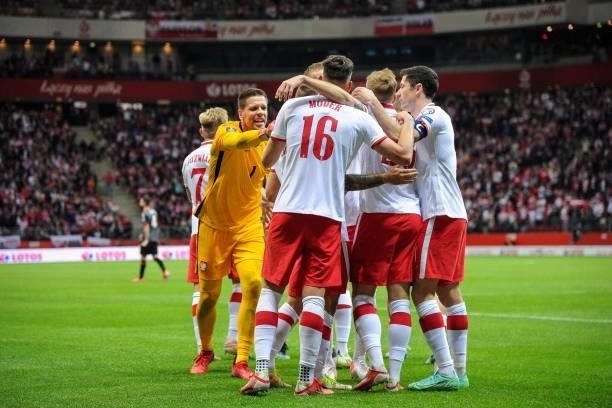 Karol Linetty, Jakub Moder, Wojciech Szczesny and Robert Lewandowski of Poland celebrate scoring the goal with during the 2022 FIFA World Cup...