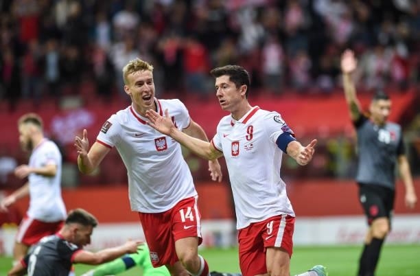 Adam Buksa and Robert Lewandowski of Poland reacts during the 2022 FIFA World Cup Qualifier match between Poland and Albania at National Stadium on...