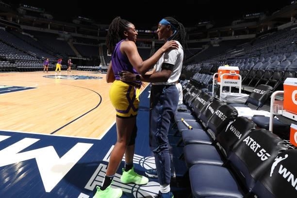 Nneka Ogwumike of the Los Angeles Sparks and Sylvia Fowles of the Minnesota Lynx embrace before the game on September 2, 2021 at Target Center in...