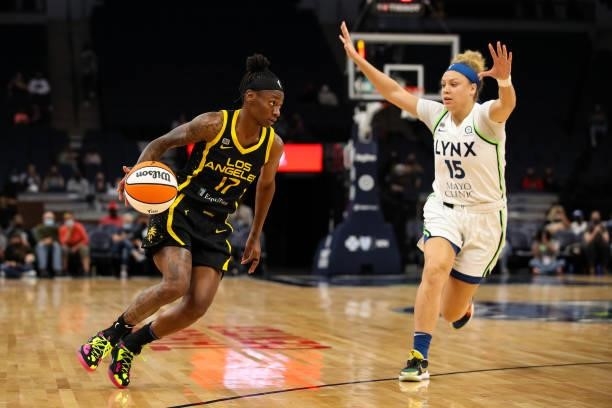 Erica Wheeler of the Los Angeles Sparks dribbles the ball past Rachel Banham of the Minnesota Lynx in the first half of the game at Target Center on...