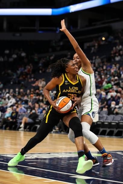 Nneka Ogwumike of the Los Angeles Sparks drives to the basket while Napheesa Collier of the Minnesota Lynx defends in the first half of the game at...