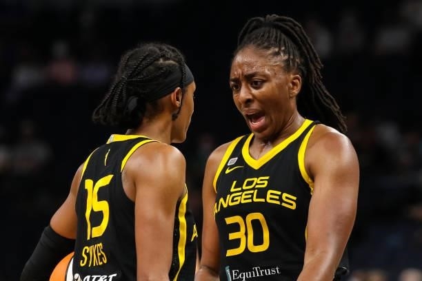 Nneka Ogwumike celebrates with Brittney Sykes of the Los Angeles Sparks after Sykes drew a foul against the Minnesota Lynx in the first half of the...