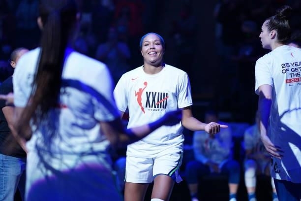 Napheesa Collier of the Minnesota Lynx hi-fives teammates before the game against the Los Angeles Sparks on September 2, 2021 at Target Center in...