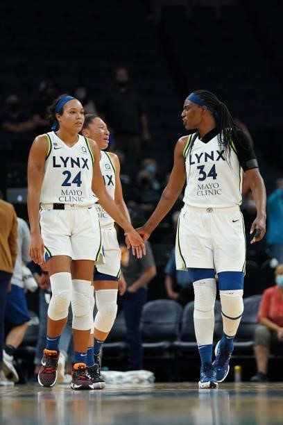 Sylvia Fowles hi-fives Napheesa Collier of the Minnesota Lynx during the game during the game against the Los Angeles Sparks on September 2, 2021 at...