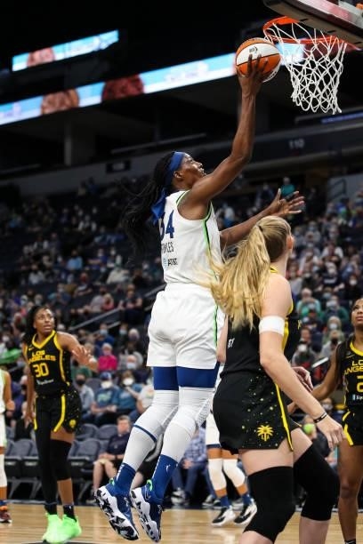 Sylvia Fowles of the Minnesota Lynx goes up for a shot past Lauren Cox of the Los Angeles Sparks in the second half of the game at Target Center on...