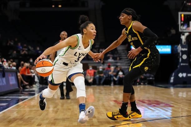 Aerial Powers of the Minnesota Lynx dribbles the ball while Brittney Sykes of the Los Angeles Sparks defends in the second half of the game at Target...