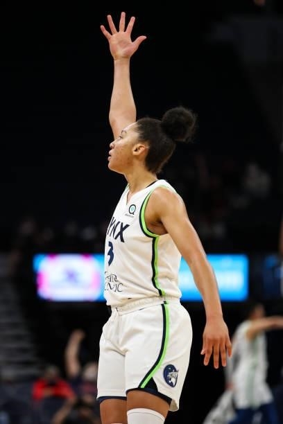 Aerial Powers of the Minnesota Lynx celebrates after making a three-point shot against the Los Angeles Sparks in the second half of the game at...