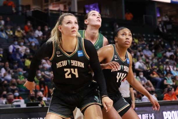 Kylee Shook and Betnijah Laney of the New York Liberty box out Stephanie Talbot of the Seattle Storm during the game on September 2, 2021 at the...