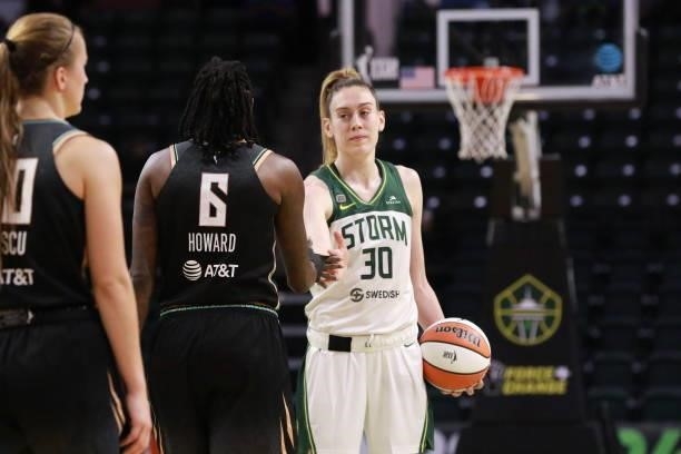 Breanna Stewart of the Seattle Storm high-fives Natasha Howard of the New York Liberty after the game on September 2, 2021 at the Angel of the Winds...