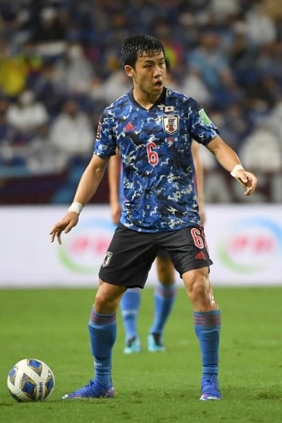 Wataru Endo of Japan keeps the ball during FIFA World Cup Asian Qualifier Final Round Group B match between Japan and Oman at Panasonic Stadium Suita...