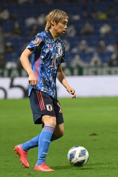 Junya Ito of Japan dribbles the ball during FIFA World Cup Asian Qualifier Final Round Group Bmatch between Japan and Oman at Panasonic Stadium Suita...