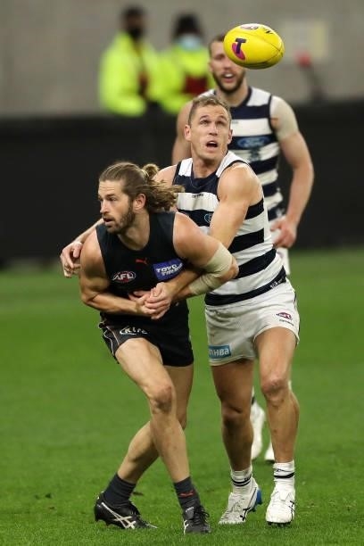 Callan Ward of the Giants is tackled by Joel Selwood of the Cats during the 2021 AFL Second Semi Final match between the Geelong Cats and the GWS...